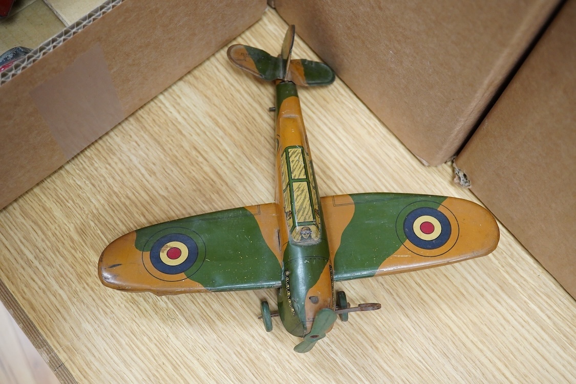 Five tinplate and diecast toys; a Wells Brimtoy tinplate London transport trolley bus, a tinplate RAF fighter aircraft possibly by Mettoy, two TTi (TT Industries) diecast Allard saloon cars, and an Arber Products diecast